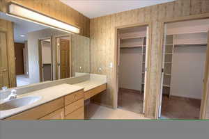 Bathroom with vanity, and two spacious closets
