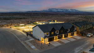 Aerial view at dusk featuring a mountain view