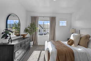 Bedroom featuring baseboards and light carpet