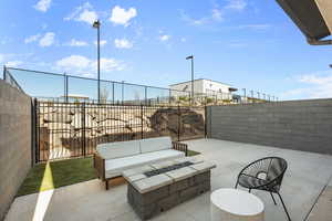 View of patio / terrace featuring a fenced backyard and an outdoor fire pit