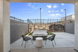 View of patio / terrace featuring a fenced backyard and an outdoor living space with a fire pit
