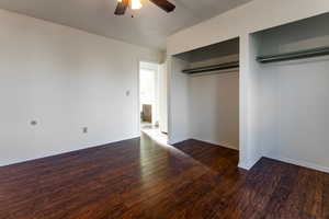 Unfurnished bedroom with baseboards, ceiling fan, and wood finished floors