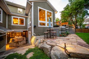 Exterior space with fence and a deck