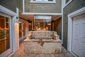 Basement walkout with waterfall and fire bar