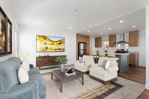 Living area featuring recessed lighting, baseboards, and wood finished floors