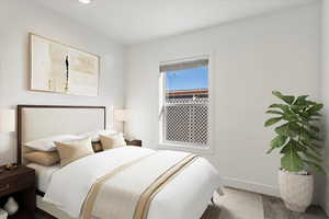 Carpeted bedroom with baseboards