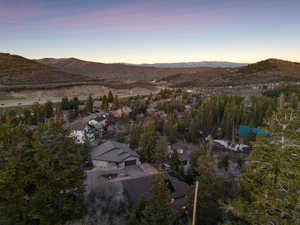 Aerial view at dusk featuring a mountain view