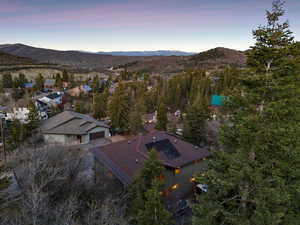 Aerial view at dusk featuring a mountain view