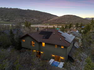 Aerial view at dusk featuring a mountain view