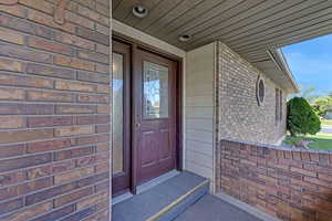Property entrance with brick siding