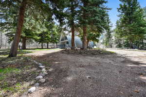 View of yard featuring fence