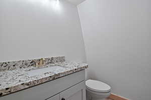 Bathroom featuring toilet and vanity