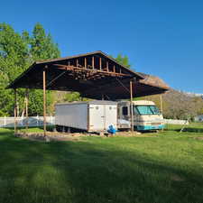 Exterior space featuring a large carport and covered RV parking