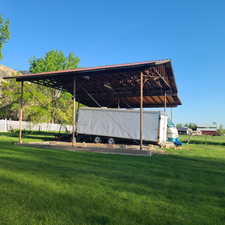 Exterior space featuring a large carport and covered RV parking