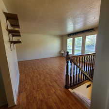 Family Room on upper level with laminate wood flooring