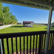 View of backyard and carport/covered RV parking