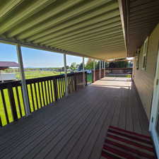 Large covered deck with access from dining room and master bedroom