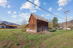View of outbuilding with a mountain view and an outbuilding