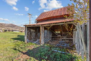 View of outbuilding with an outdoor structure and a mountain view