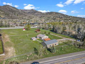 Birds eye view of property with a mountain view