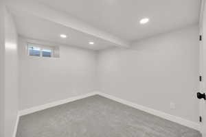 Basement with baseboards, carpet flooring, and recessed lighting