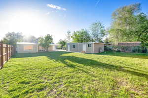 View of yard featuring fence