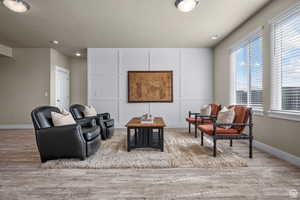 Living area featuring baseboards and wood finished floors