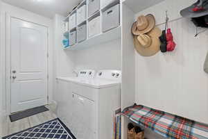 Laundry room with separate washer and dryer and laundry area