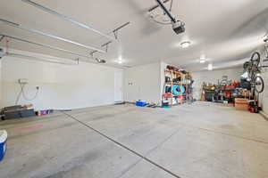 Garage featuring a garage door opener