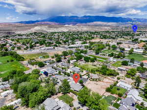 Birds eye view of property with a mountain view