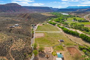 Birds eye view of property with a mountain view and a rural view