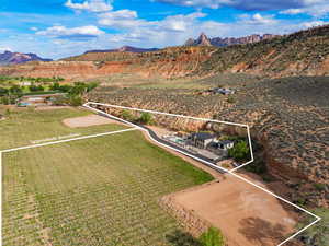 Birds eye view of property with a mountain view and a rural view