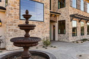 Property entrance with stone siding