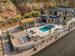 View of swimming pool with a fenced backyard, a fenced in pool, a patio, and an outdoor fire pit