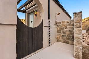 Doorway to property with stucco siding