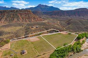 Drone / aerial view with a mountain view and a rural view