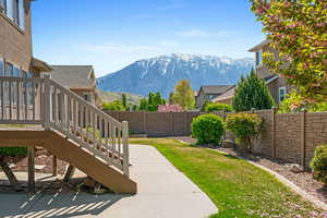 View of yard featuring a mountain view and a fenced backyard