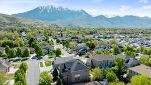 Birds eye view of property with a residential view and a mountain view