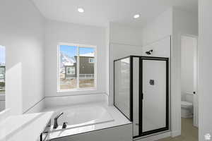 Full bath with toilet, recessed lighting, a garden tub, and a stall shower