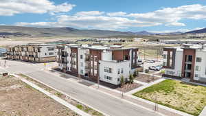 Exterior space with stucco siding and a mountain view