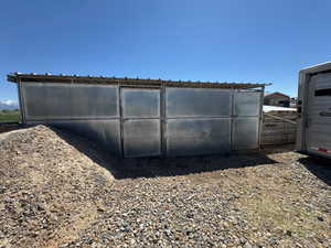 View of outdoor structure featuring fence
