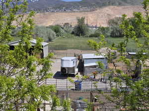 Birds eye view of property featuring a mountain view and a rural view