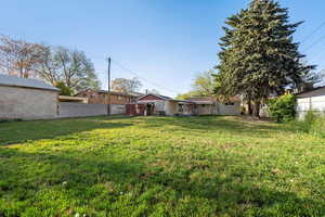 View of yard featuring fence
