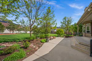 View of yard with a patio area and fence