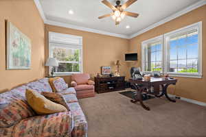 Home office with carpet flooring, crown molding, ceiling fan, recessed lighting, and baseboards