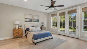 Bedroom featuring baseboards, access to outside, a ceiling fan, and light wood finished floors