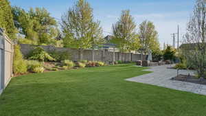 View of yard with a fenced backyard, a pergola, an outdoor hangout area, and a patio area