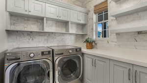 Washroom with independent washer and dryer and cabinet space