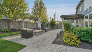View of patio / terrace with fence and a fire pit