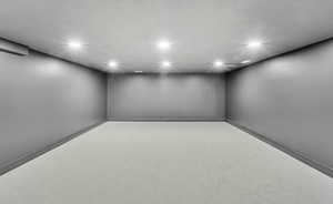 Finished below grade area with recessed lighting and baseboards